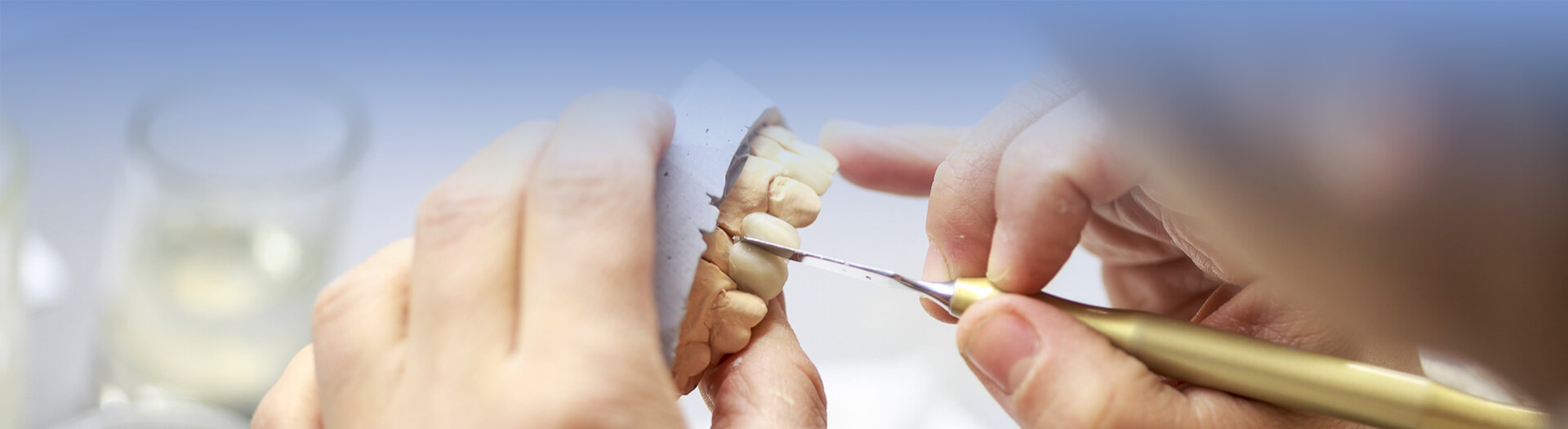 Dental technician working on a dental casting