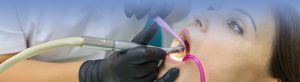 Adult female dentist treating patient woman teeth 