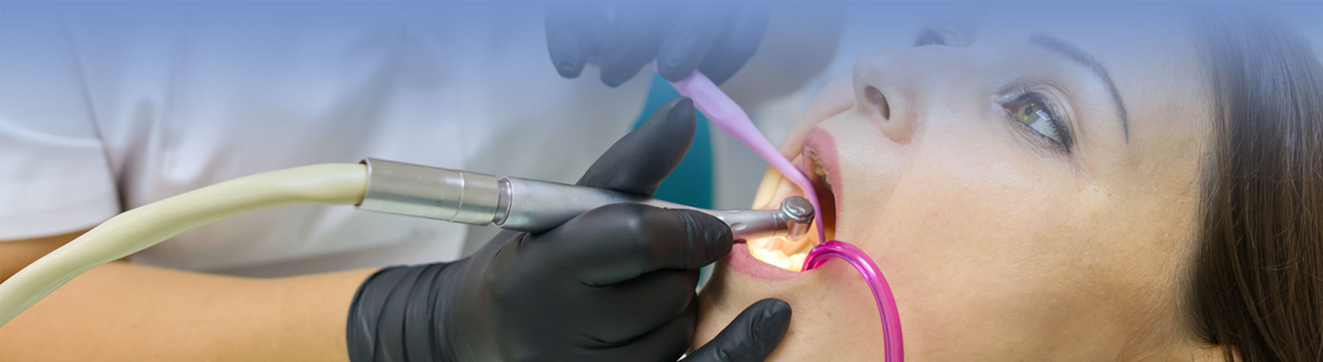 Adult female dentist treating patient woman teeth
